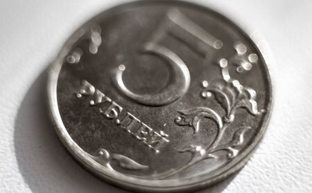 coin in five Russian rubles close-up on a white background.