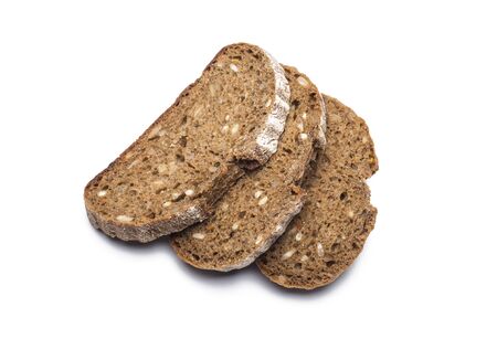 three pieces of black bread with sunflower seeds on a white background.