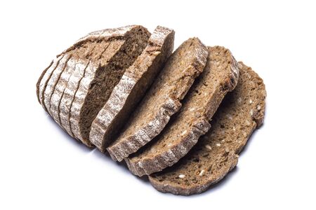 sliced into even slices, black farm bread with sunflower seeds on a white background.の写真素材