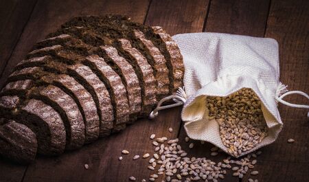 bag of grains with farm whole grain bread with nuts and fruit added, on the Board.