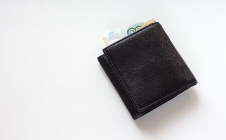 black leather wallet with Russian money on a white backgroundの写真素材