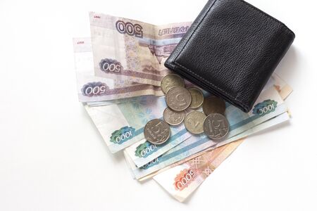 the remaining money for payment on the table and a black wallet on them.
