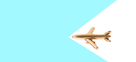 Flat travel concept design with a plane on a blue and white background with copy space.の写真素材