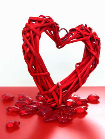 lots of little red hearts and one big one on a white background. Valentine's day.