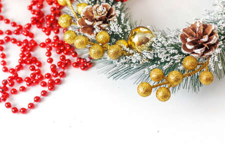 Close-up of a fragment of a Christmas wreath on a white background.