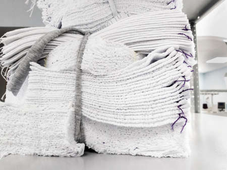 cotton white knitwear details are stacked for further tailoring of products