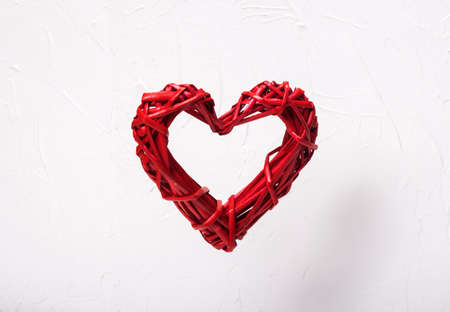 levitation wicker red heart on white background concept valentine's day, free open heart.の写真素材