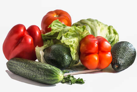 various vegetables, avocado with cucumber and parsley, bell pepper and tomatoの写真素材