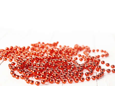 Mardi Gras party red beads on a white background with a copy of the space.の写真素材