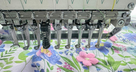 needles of a production embroidery machine in close-up operation.