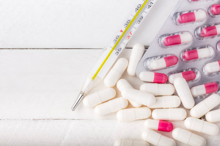 A variety of medications with a medical thermometer. The concept of medicine and healthcare