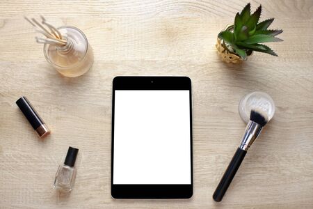 Empty digital tablet screen and cosmeticsの写真素材