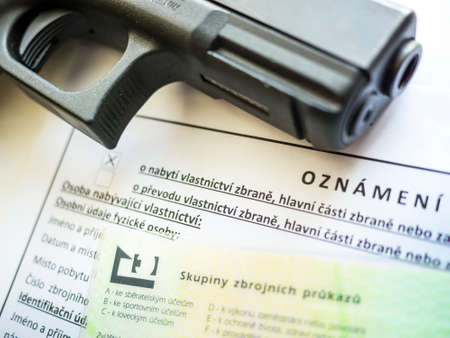 Czech firearms license with pistol and ammunition.のeditorial素材