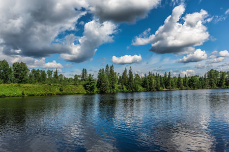 An amazing landcape of the nature containing a lake and a beautiful blue sky. The wild nature of Ontario, Canada.の写真素材