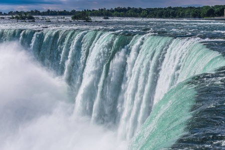 The view of the Niagra falls from the canadian side on a beautiful sunny day in Ontario, Canada.のeditorial素材