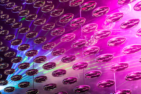 Real metal rolling oval mirrored light as abstract background.の写真素材