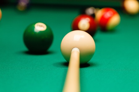 Billiard balls in a pool table.