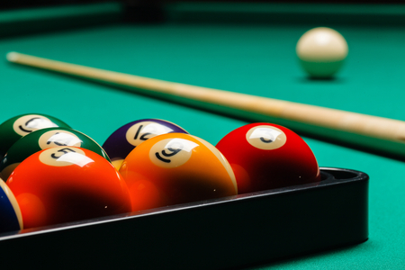 Billiard balls in a pool table.
