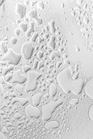 Metal surface covered in water drops bottom, closeup.の写真素材
