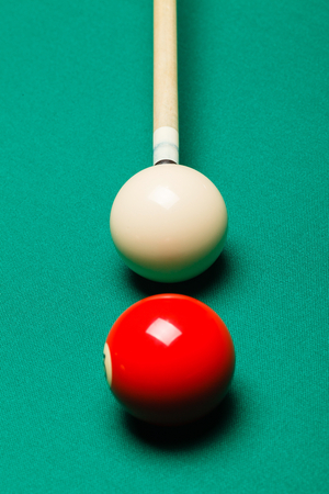 Billiard balls in a pool table.