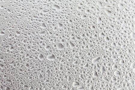 Metal surface covered in water drops bottom, closeup.