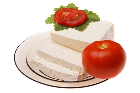 Original bulgarian cheese with tomato into plateの写真素材