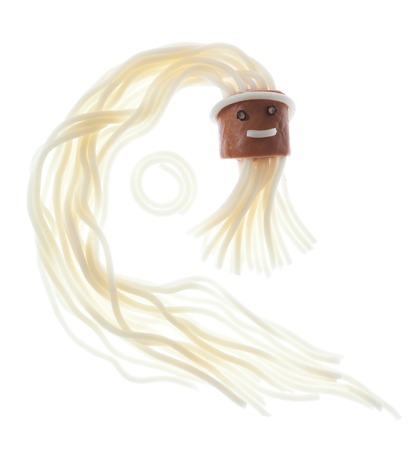 sausage with spaghetti  arranged like a abstract face, isolated white