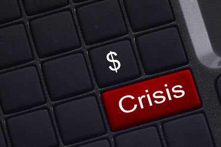 mini keyboard with selective focus on the enter button saying Crisis