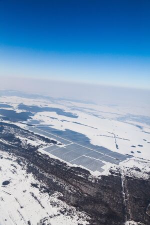 Aerial photo of solar power plant. Many solar energy panels in countryside from above. Photovoltaic...