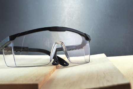 Eye protection on the wood plateの写真素材