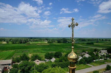 Ukrainian Christian church on the background of the village