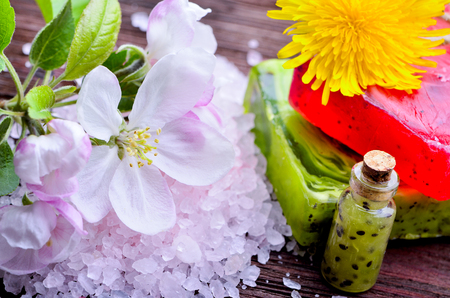 spa. Flowers with sea salt. soap with fruit on a wooden background oldの写真素材