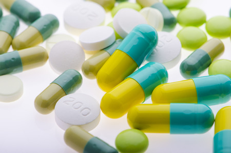 Green pills background on the whiteの写真素材