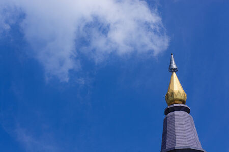 Blue sunny sky with thai pagoda in frontの写真素材