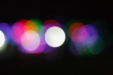 Colorful blurry light bulb with out of focus technique.の写真素材