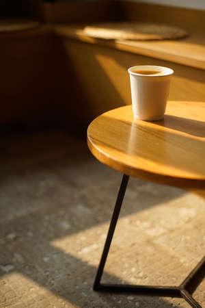 Coffee cup on table in coffee shop. Coffee break conceptの写真素材
