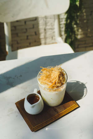Coffee latte with milk and cheese on the table.の写真素材