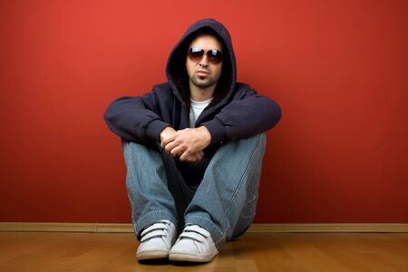 Fashion Shot of a Young Man A trendy European man dressed in contemporary cloth with eye-glasses.の写真素材