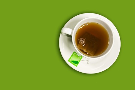 Cup of tea on green backgroundの写真素材