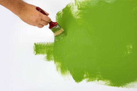 Green painting with a paint brushの写真素材