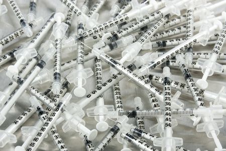 Many medical syringesの写真素材