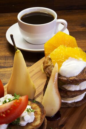 Fresh breakfast, juice and coffee od wooden desk