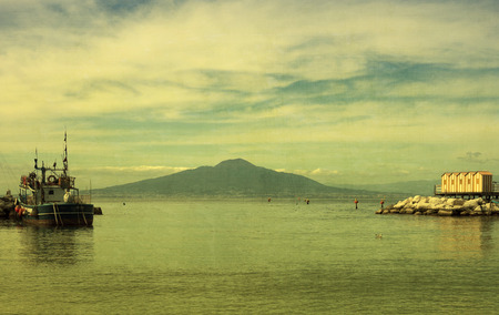 Mount Vesuvius and the Bay of Naples Italy with a green tinged vintage texture filter