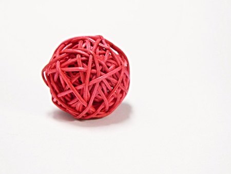 Woven wickerwork ball on white backgroundの写真素材