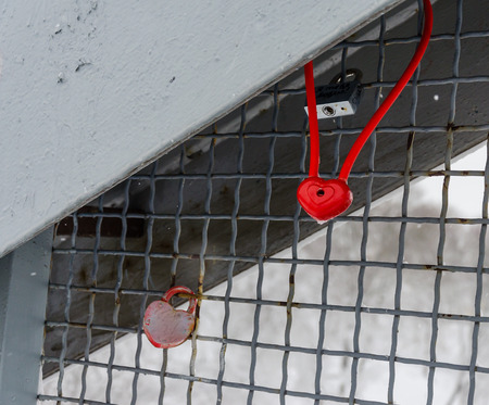 Red padlock in the shape of heart the closed red padlock love padlockの写真素材