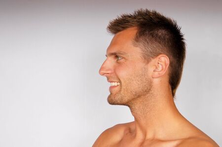 Profile of smiling attractiv young man. You can write text in left side.の写真素材