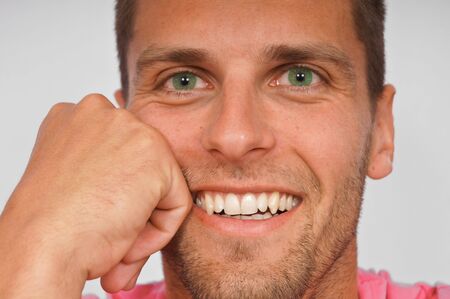 Close up portrait of smiling attractiv young manの写真素材