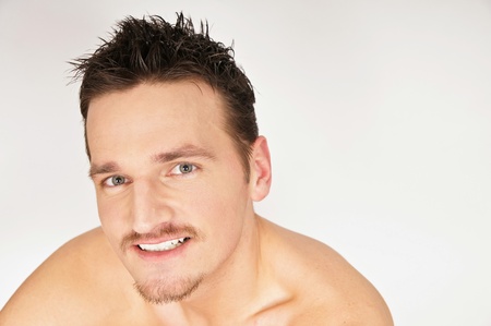 Portrait of young smiling man. You can write text on right side.の写真素材