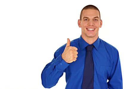 Young smiling businessman showing thumb up, you can left write text の写真素材