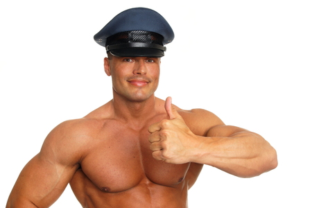 Big muscular man at police showing thumb upの写真素材